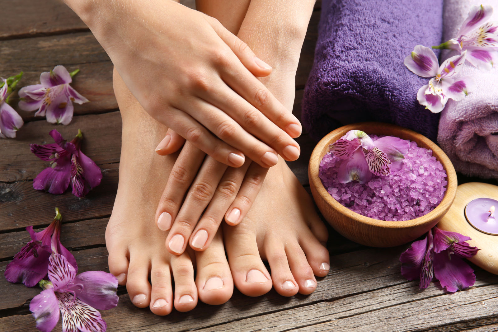 Female feet at spa pedicure procedure